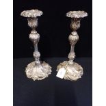 A PAIR OF ROCOCO STYLE SILVER PLATED CANDLESTICKS