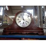 A 1920s WALNUT CASED, 'BICORN' MANTEL CLOCK