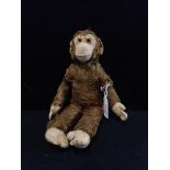 A VINTAGE PLUSH TOY MONKEY