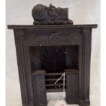 A 19TH CENTURY MINIATURE CAST IRON FIRE GRATE, 22.5cm high