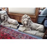 A NON-OPPOSING PAIR OF RECONSTITUTED STONE LIONS
