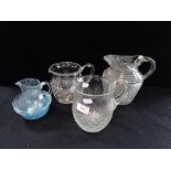 A COLLECTION OF GLASS JUGS