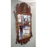 A GEORGE III WALNUT FRAMED WALL MIRROR