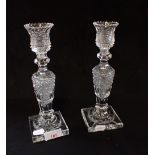 A PAIR OF EDWARDIAN CUT GLASS CANDLESTICKS