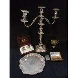 A SILVER PLATED THREE BRANCH CANDELABRA