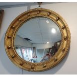 A REGENCY STYLE CONVEX WALL MIRROR