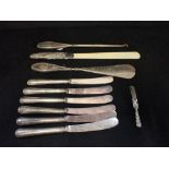 A SET OF SIX SILVER HANDLED BUTTER KNIVES