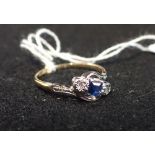 A THREE STONE DIAMOND AND SAPPHIRE RING