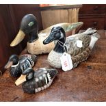 A CARVED AND PAINTED DECOY DUCK