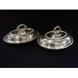 A PAIR OF SILVER PLATED OVAL LIDDED SERVING DISHES