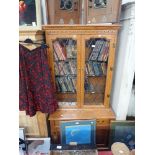 A LIGHT OAK DISPLAY CABINET