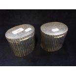 A PAIR OF SILVER PLATED CANISTERS