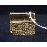 A GOLD CASED CIGARETTE LIGHTER