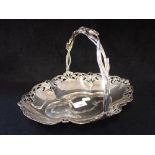 AN ART NOUVEAU SILVER PLATED SWING HANDLE DISH