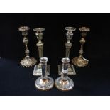 A PAIR OF SILVER PLATED ROCOCO CANDLESTICKS