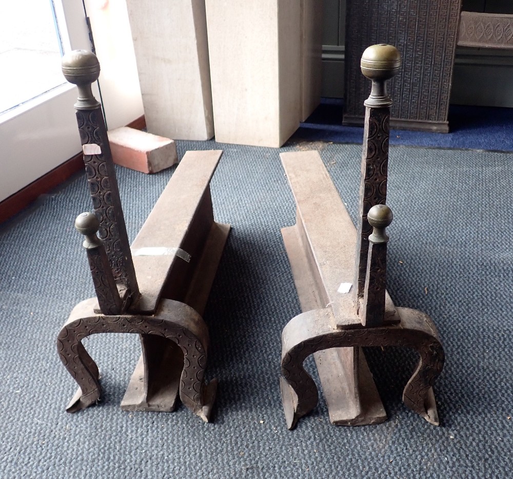 A PAIR OF LARGE IRON AND BRASS FIREDOGS