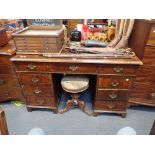 A FIGURED WALNUT PEDESTAL DESK