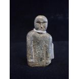 AN INUIT CARVING OF A MALE FIGURE