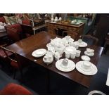 A GEORGE III MAHOGANY DROP FLAP DINING TABLE,