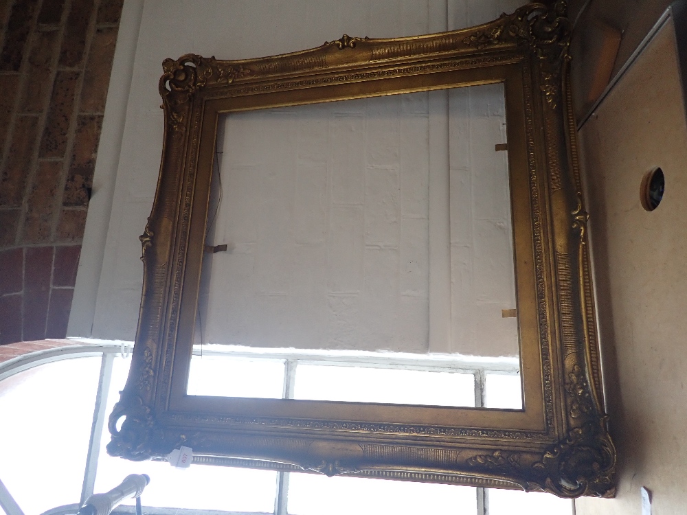 A MOULDED AND GILT 18TH CENTURY STYLE PICTURE FRAME
