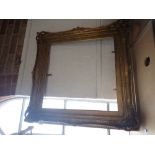 A MOULDED AND GILT 18TH CENTURY STYLE PICTURE FRAME