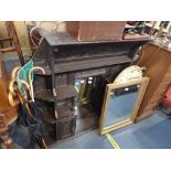 A VICTORIAN CARVED OAK OVERMANTLE MIRROR