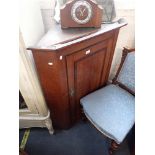 A GEORGE III OAK CORNER CABINET