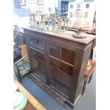 AN EDWARDIAN OAK GLAZED BOOKCASE,