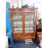 AN EDWARDIAN GLAZED MAHOGANY DISPLAY CABINET