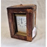 AN EDWARDIAN BRASS CASED CARRIAGE CLOCK