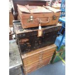 A VINTAGE LEATHER SUITCASE