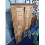 A GEORGE III STRIPPED PINE CORNER CABINET