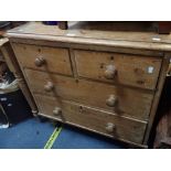 A VICTORIAN STRIPPED PINE CHEST OF DRAWERS