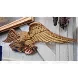 A VINTAGE CAST ALUMINIUM PLAQUE DEPICTING THE AMERICAN EAGLE