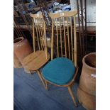 ERCOL: A PAIR OF PALE ELM AND BEECH COMB BACK CHAIRS