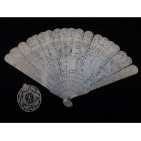 A 19TH CENTURY CARVED AND PIERCED IVORY FAN