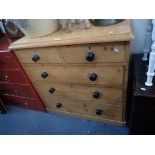 A VICTORIAN STRIPPED PINE CHEST OF DRAWERS