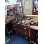 AN EDWARDIAN CHEST OF DRAWERS WITH BRASS 'SHELL' HANDLES