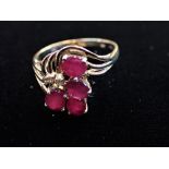 A 'RUBY' RING ON A 9CT GOLD SHANK,