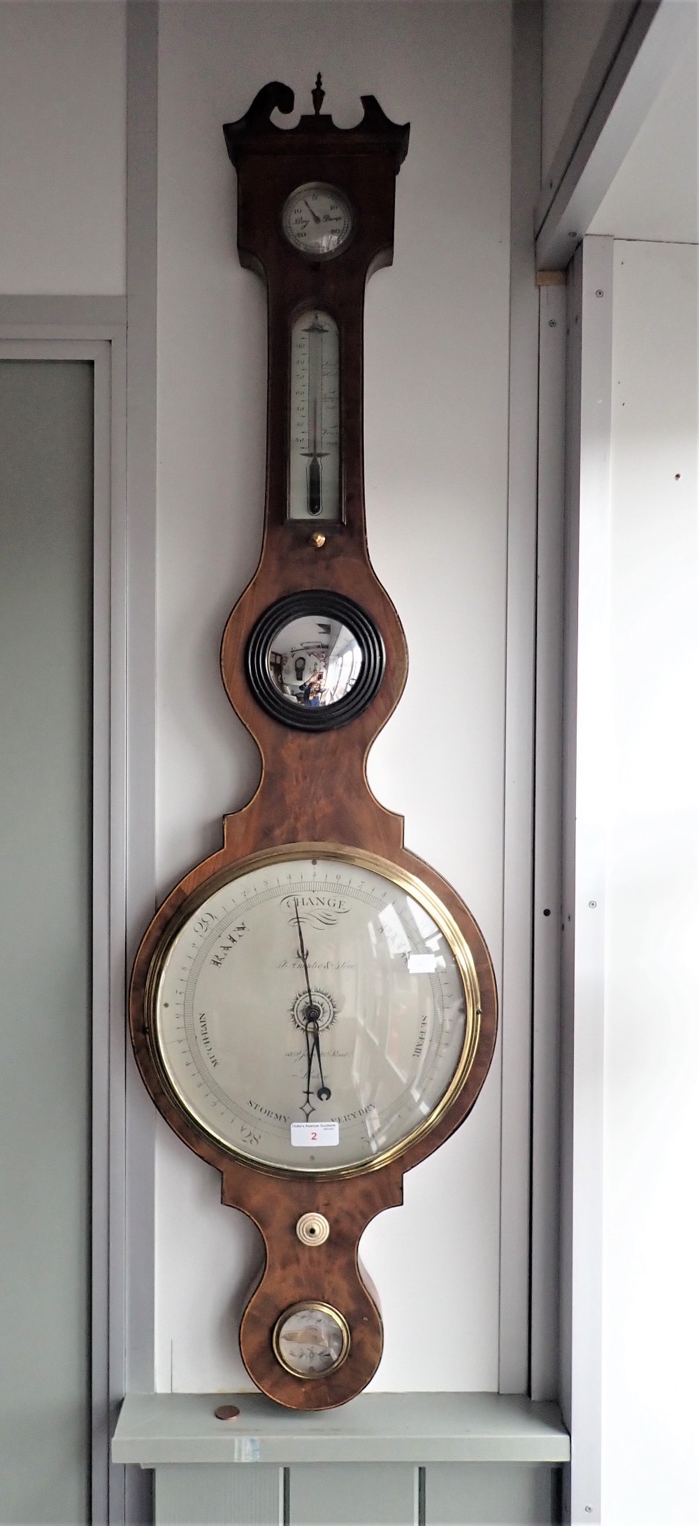 A GEORGE III MAHOGANY WHEEL BAROMETER