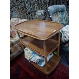 ERCOL; A PALE ELM THREE TIER TROLLEY