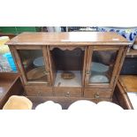 AN EDWARDIAN OAK SMOKER'S CABINET