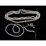 A THREE STRAND CULTURED PEARL NECKLACE