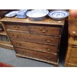 A GEORGE III OAK CHEST OF DRAWERS