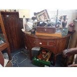 A GEORGE III MAHOGANY BOWFRONT CORNER CUPBOARD