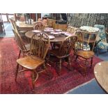 A SET OF SIX REPRODUCTION ELM AND ASH HOOP BACK WINDSOR CHAIRS