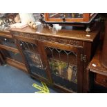 AN OAK BOOKCASE, WITH LEADED GLAZED DOORS,