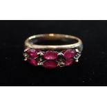 A 'RUBY' AND CLEAR STONE RING,