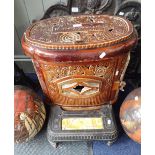 A VINTAGE FRENCH CAST IRON AND BROWN ENAMEL MULTI-FUEL STOVE