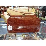 A VINTAGE CROCODILE SKIN HANDBAG